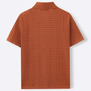 Back view of men's burnt orange textured jacquard knit short sleeve polo shirt.