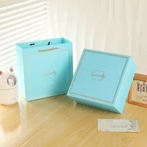 Elegant Tiffany blue gift box set with matching paper bag and gold cursive text