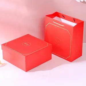Elegant red gift box and matching paper bag set with gold 'Good Luck' foil stamp
