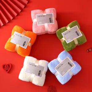 Close-up of five colorful soft microfiber face towels arranged in a gift box style