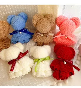 Detailed view of soft bear-shaped towels in multiple colors with Just for you ribbons