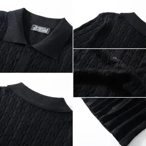 Close-up detail of black knitted polo shirt showing textured jacquard fabric pattern