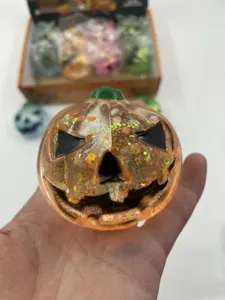 Macro view of a glittery Halloween pumpkin squishy toy designed for stress relief