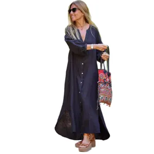 Elegant black cotton linen maxi dress with V-neck and puff sleeves, perfect for summer.