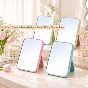 Set of foldable desktop makeup mirrors in pastel pink, blue, green and beige.