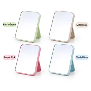 Foldable desktop makeup mirrors in four pastel colors: green, beige, pink, and blue.