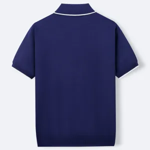 Back view of navy blue short-sleeved knitted polo shirt with white tipped collar detail.