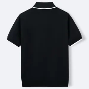 Detailed back view of a black short-sleeved knitted polo shirt with white contrast stripes.