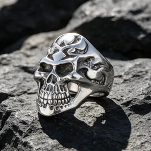 Bold gothic punk skull ring made of durable stainless steel on rock background