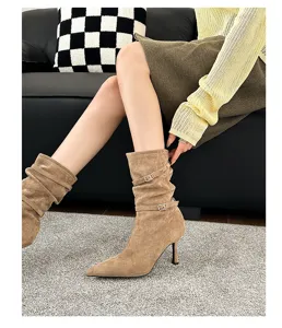 Chic brown pointed-toe stiletto slouchy boots with stylish buckle details.
