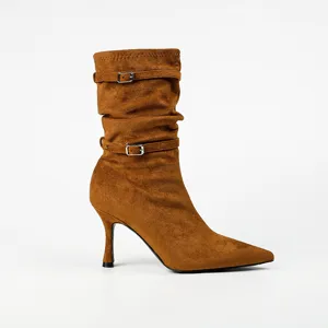 Elegant tan pointed-toe stiletto boots with buckle straps and slouchy stretch design