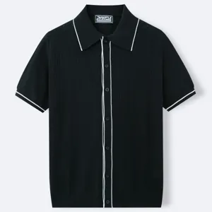 Close-up of men's black short-sleeve knit polo shirt featuring white piping details