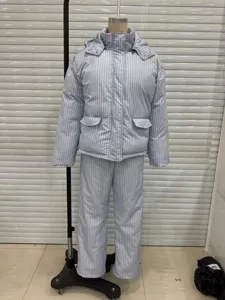 Full-length detail of light blue striped winter puffer jacket and wide-leg pants set