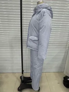 Side view of blue striped hooded puffer jacket and wide-leg trousers set on mannequin.