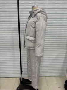 Detailed side view of women's striped hooded padded jacket and matching wide-leg pants set