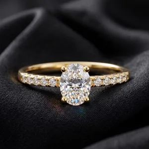 Macro detail of elegant oval cut moissanite engagement ring on black silk background