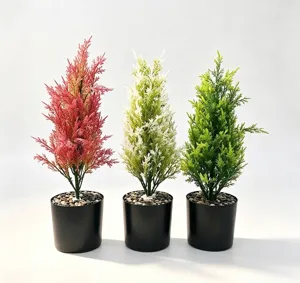 Set of three artificial cypress trees in red white and green black pots for home decor