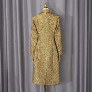 Back view of an elegant shimmering gold tweed mid-length coat displayed on a mannequin.