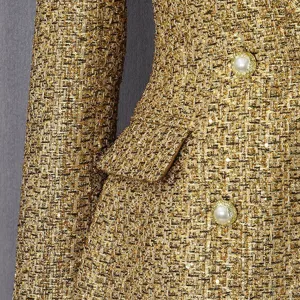 Close-up detail of a high-end gold tweed coat featuring intricate weave and pearl buttons