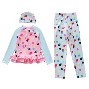 Three-piece children's swimsuit set featuring long-sleeve polka dot top and matching pants