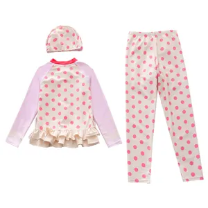 Three-piece girls long-sleeve swimwear set featuring pink polka dots and ruffles