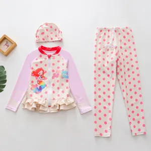 Three-piece pink polka dot girl's swimwear set with long sleeves and mermaid print