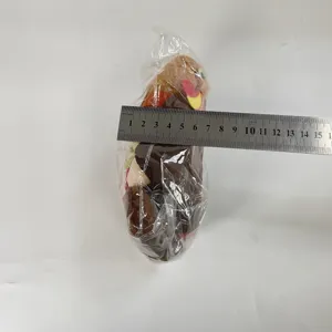Detail view showing size measurement of a Thanksgiving harvest turkey plush gnome doll