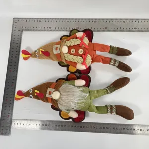 Thanksgiving turkey gnome couple plush toys shown with a ruler for size reference