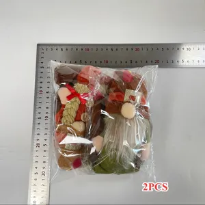 Set of two Thanksgiving Harvest Festival turkey gnome plush dolls in packaging with ruler scale