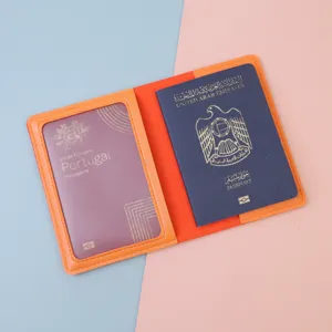 Interior detail of an orange RFID-blocking passport cover with two passport slots