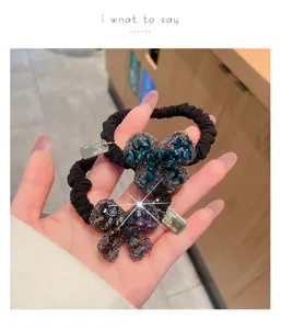 Exquisite rhinestone bow hair tie detail, elegant black elastic rubber band for women and girls.
