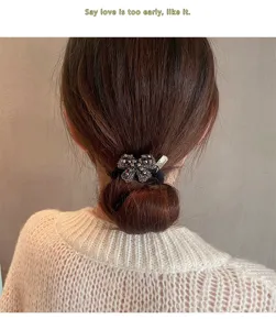 Detailed close-up view of a Korean style rhinestone bow hair tie, elegant sparkling hair accessory.