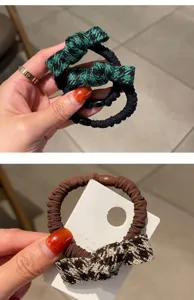 Détail chouchou nœud pied-de-poule, élastique cheveux haute élasticité pour coiffure queue de cheval.