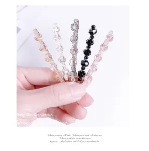 Crystal beaded bobby pin detail showing multi-color rhinestone hair clip in elegant style.