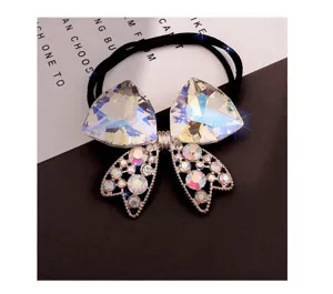 Luminoso elastico per capelli con fiocco in cristallo e strass, accessorio elegante.