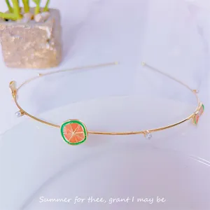 Chic metal fruit headband featuring orange slice and white pearl for sweet daily style.