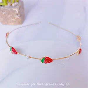 Sweet red strawberry metal headband with pearls, elegant Korean style hair accessory detail.