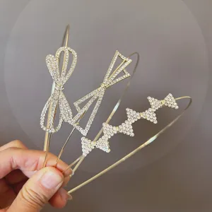 Sparkling rhinestone bow metal headbands set, crystal hair hoops for women party styling.