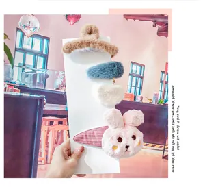 Cute plush hair clips set featuring brown claw clip, blue oval, white heart and pink bunny.
