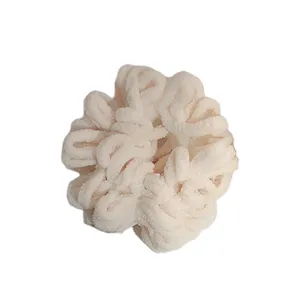 Fluffy plush hair scrunchie in solid beige, soft winter velvet hair tie for women and cute daily buns.