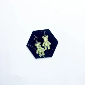 Glitter resin bear earrings detail view, cute animal design cute jewelry accessory.
