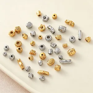 Assortiment onregelmatige roestvrijstalen kralen, goud en zilver mix voor DIY sieraden.