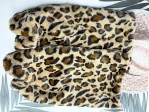 Faux fur leopard print plush tail accessory for Halloween cosplay party decoration detail.
