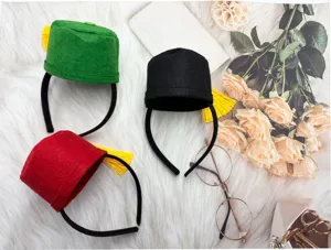 Traditional Fez hat headband with golden tassel, perfect costume accessory detail view.