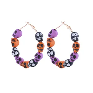 Halloween skull hoop earrings detail, black purple orange bead drops, spooky party jewelry