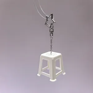 Mini white plastic stool keychain, cute nostalgic novelty bag charm and keyring accessory.