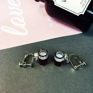 Detail shot of creative miniature beer mug clip-on earrings without piercing, fun resin design.