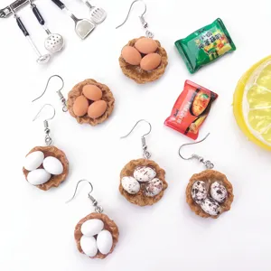 Boucles d'oreilles créatives d'œuf de nid d'oiseau faits à la main, style de nouveauté amusant.