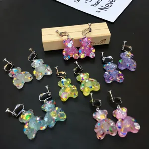 Colorful resin gummy bear clip-on earrings with glitter details for cute daily wear.