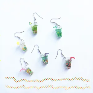Miniature fruit drink cup earrings detail view with cute resin material design